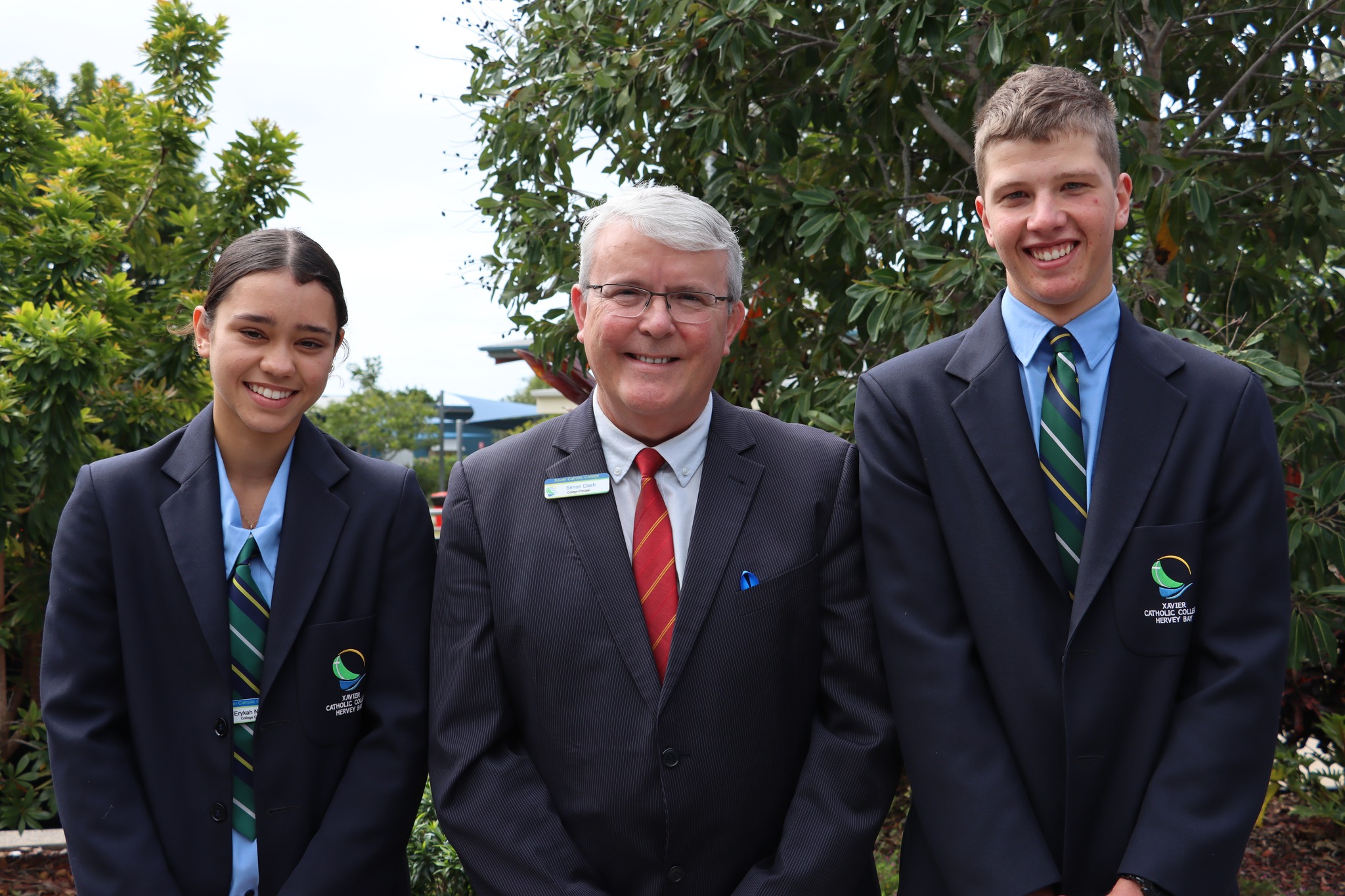 college principal with two student leaders